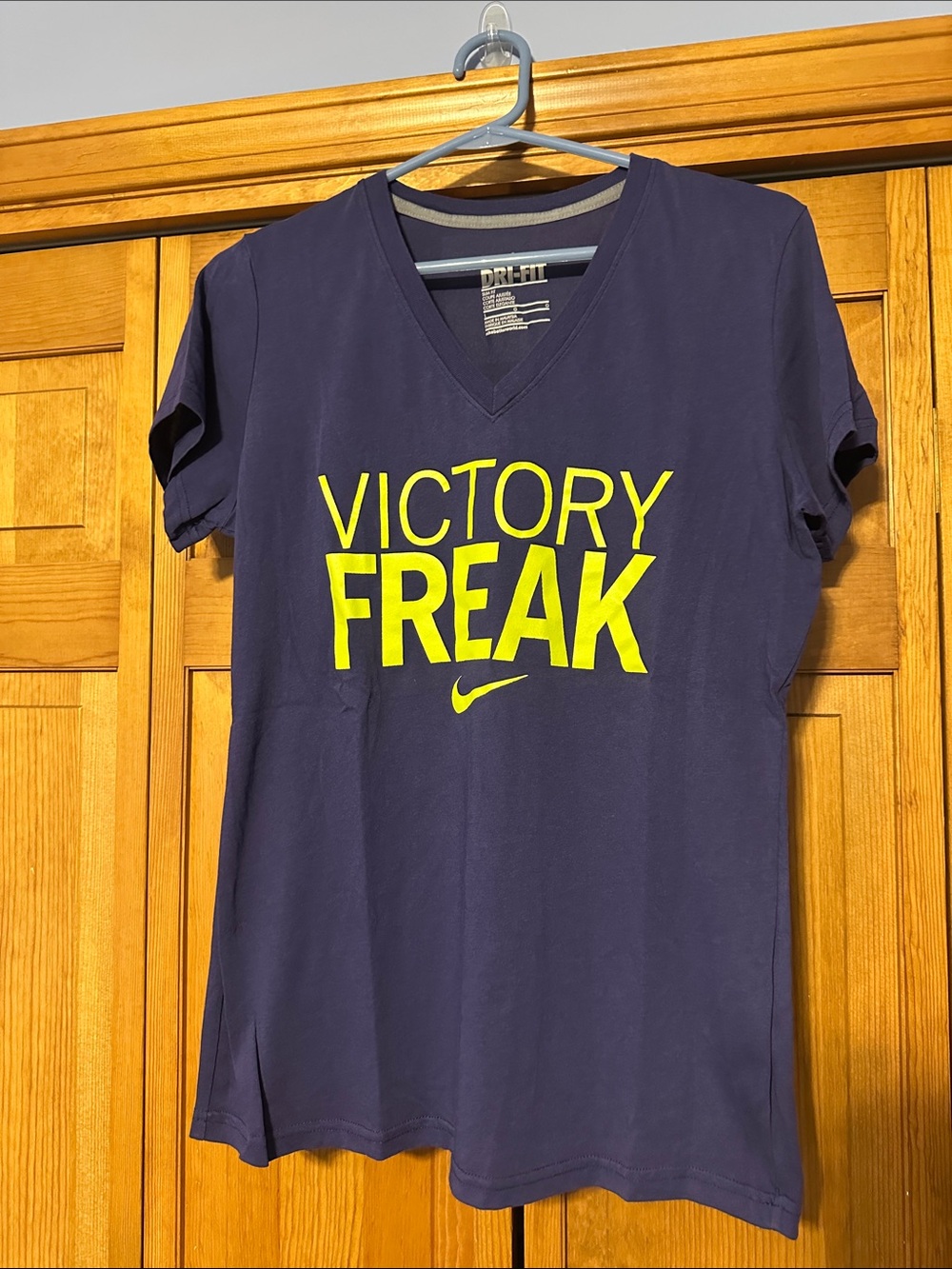 Nike Women's V-Neck Tee in Deep Purple with Yellow 'Victory Freak' Graphic